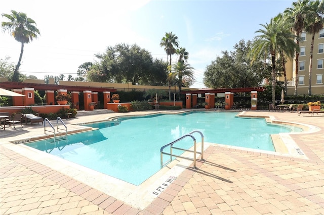 view of pool featuring a patio