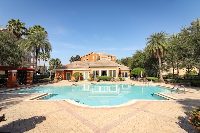 view of swimming pool featuring a patio area