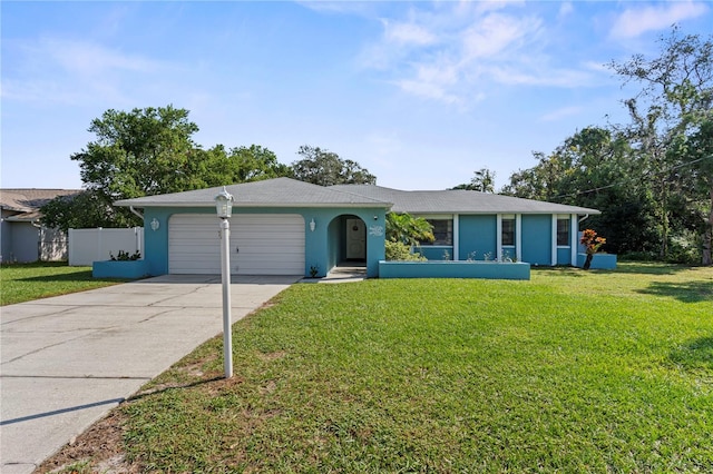 single story home with a front yard and a garage