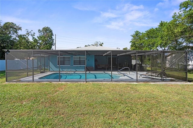 view of pool featuring a patio, a lanai, and a lawn