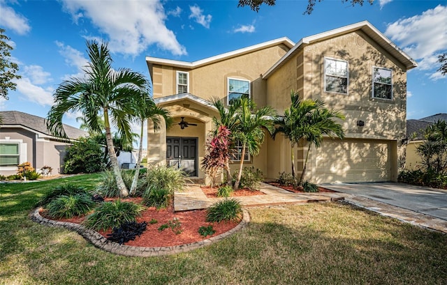 view of front facade with a front yard, french doors, and a garage