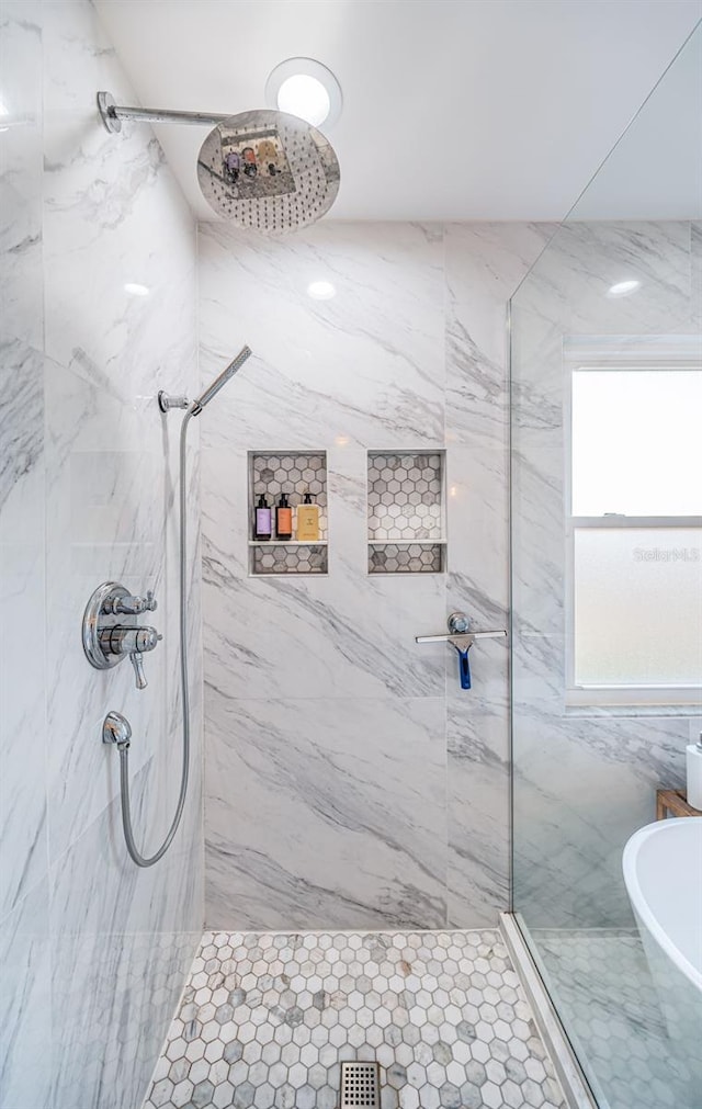 bathroom with tiled shower