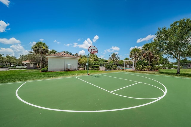 view of basketball court featuring a lawn