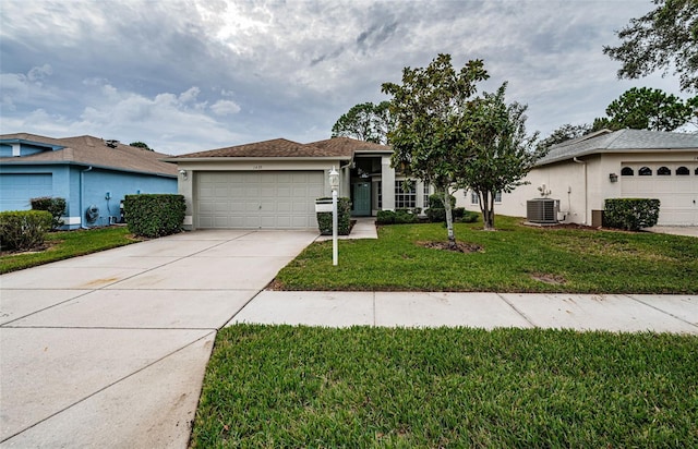 single story home featuring central AC unit, a garage, and a front yard