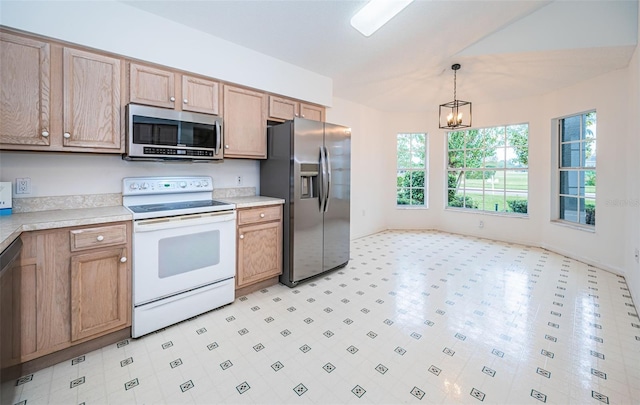 kitchen featuring stainless steel appliances, an inviting chandelier, and decorative light fixtures