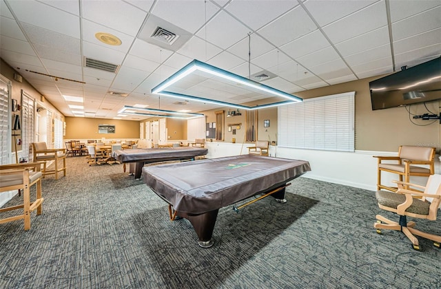 rec room with a paneled ceiling, carpet flooring, and pool table