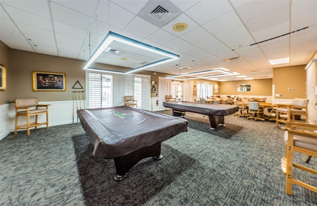 rec room with pool table, dark carpet, and a drop ceiling