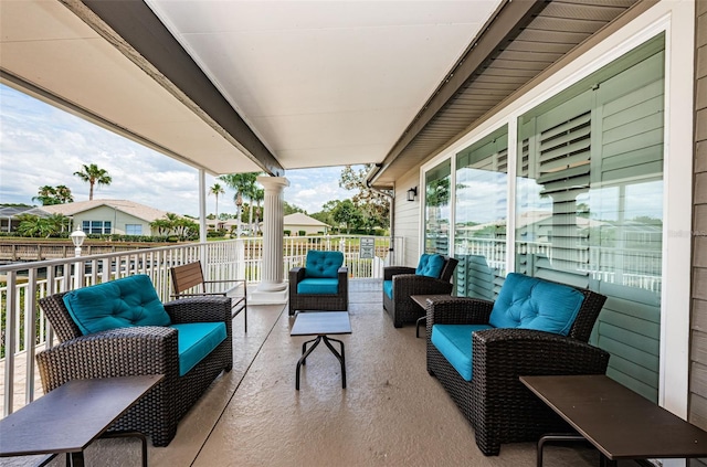 view of patio / terrace with a balcony and an outdoor hangout area