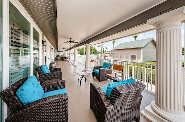 view of patio / terrace with an outdoor living space, covered porch, and ceiling fan