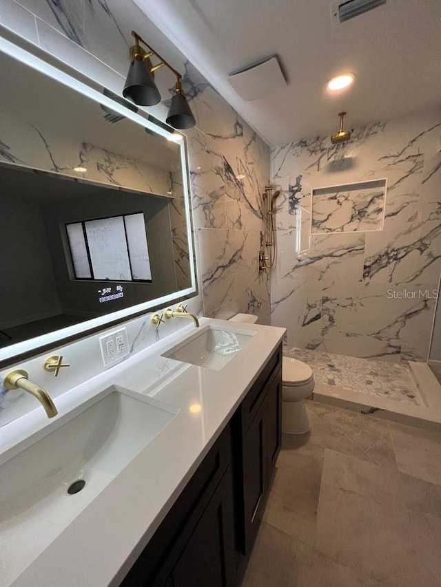 bathroom with vanity, toilet, and walk in shower