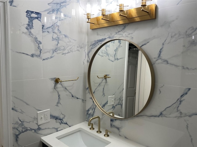 bathroom with vanity and tile walls