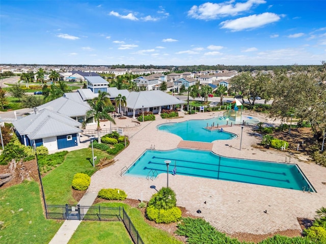 view of swimming pool with a yard and a patio area