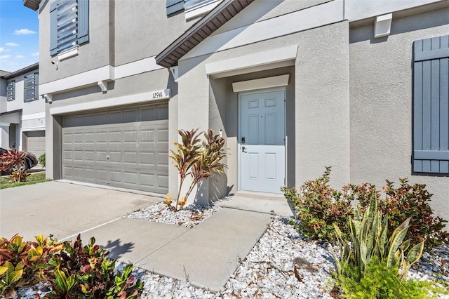 entrance to property featuring a garage