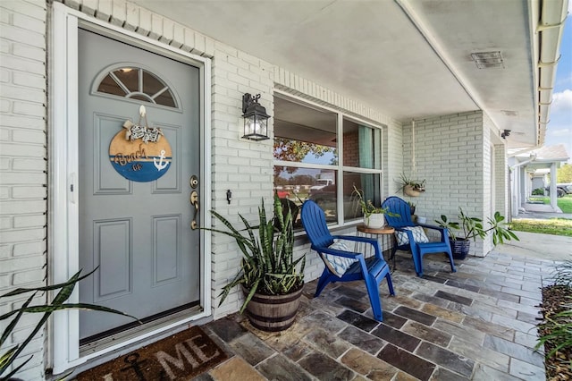 doorway to property featuring a porch