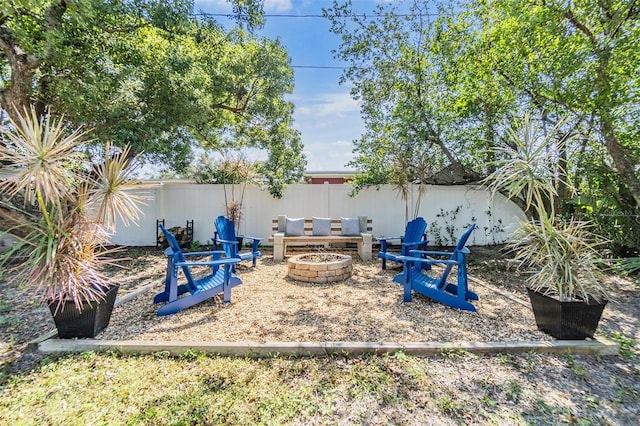 view of yard featuring an outdoor fire pit