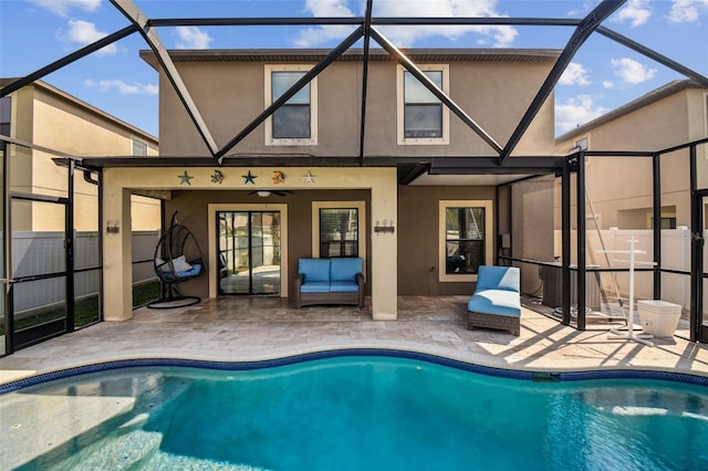 view of pool with a patio area and a lanai