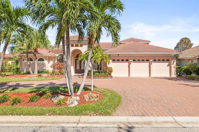 mediterranean / spanish-style home with a garage