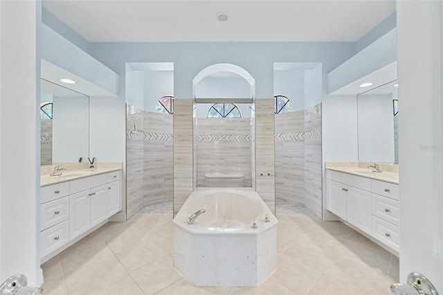 bathroom featuring tile patterned floors, vanity, and a healthy amount of sunlight