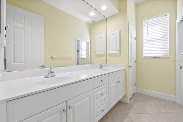 bathroom featuring tile patterned flooring, vanity, and plenty of natural light