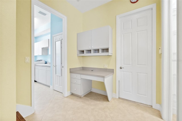 office area featuring light tile patterned flooring