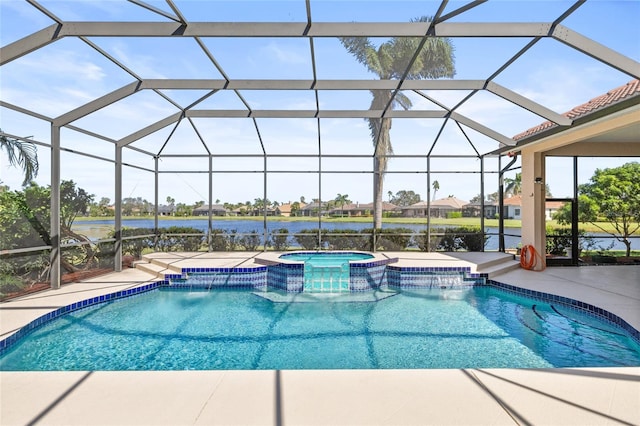 view of pool with an in ground hot tub, pool water feature, a water view, and glass enclosure