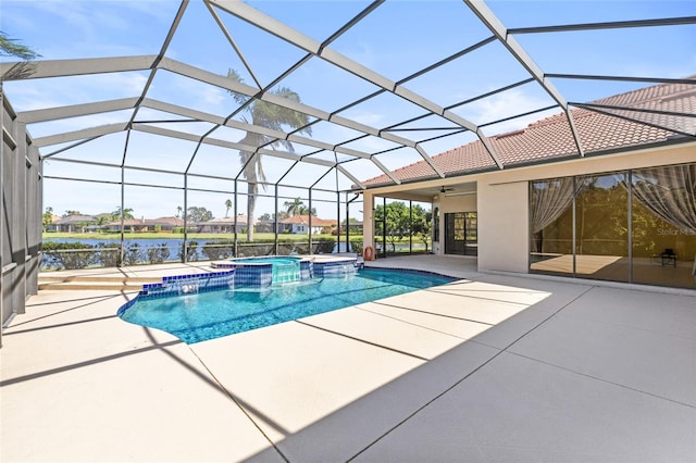 view of swimming pool featuring glass enclosure, ceiling fan, an in ground hot tub, a water view, and a patio