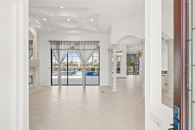 interior space featuring ornamental molding, coffered ceiling, a high end fireplace, and beam ceiling