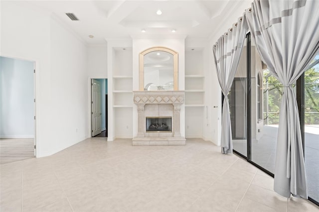 unfurnished living room featuring ornamental molding, built in shelves, light tile patterned floors, beamed ceiling, and a fireplace