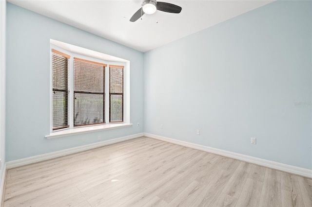 spare room with ceiling fan and light hardwood / wood-style flooring