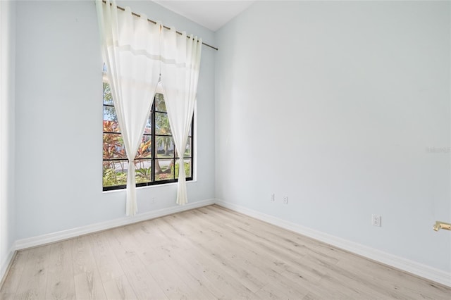 spare room featuring light hardwood / wood-style flooring