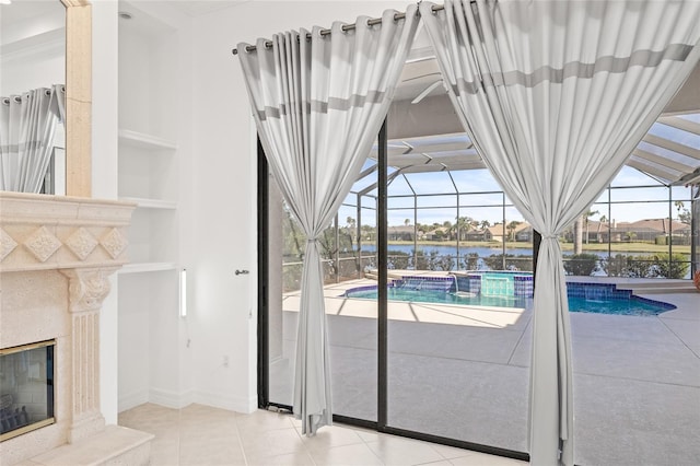 view of swimming pool featuring a water view and a premium fireplace