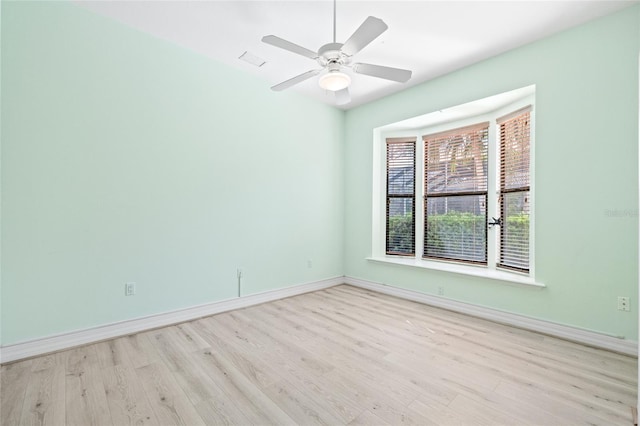 spare room featuring ceiling fan and light wood-type flooring