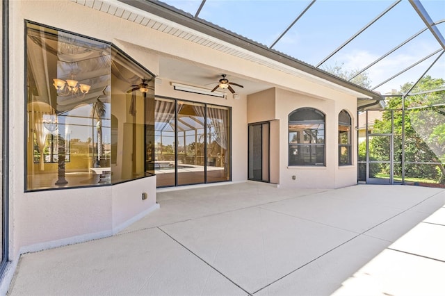 view of patio / terrace featuring ceiling fan and a lanai