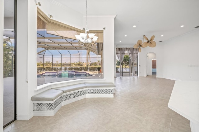 interior space with tile patterned flooring and crown molding