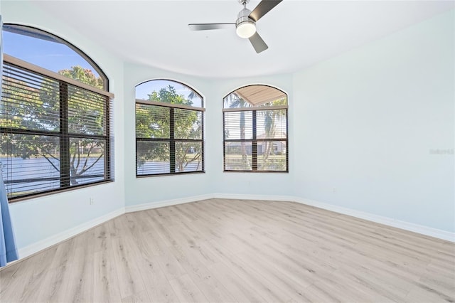 spare room with ceiling fan and light hardwood / wood-style floors