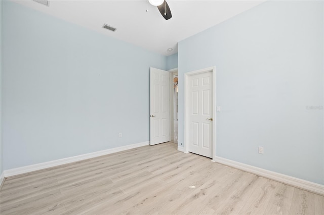 unfurnished room with ceiling fan and light hardwood / wood-style flooring