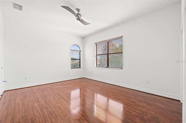 empty room featuring wood-type flooring and ceiling fan