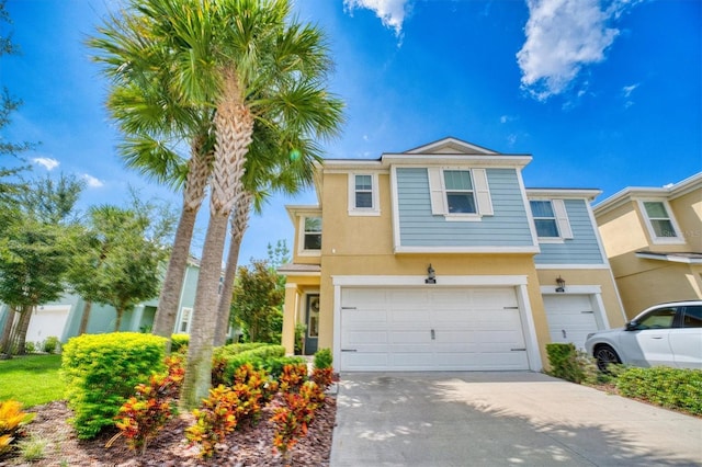 2001 Palm Key Ave, Oldsmar, FL 34677 - view of front of home featuring stucco siding, an attached garage, and driveway