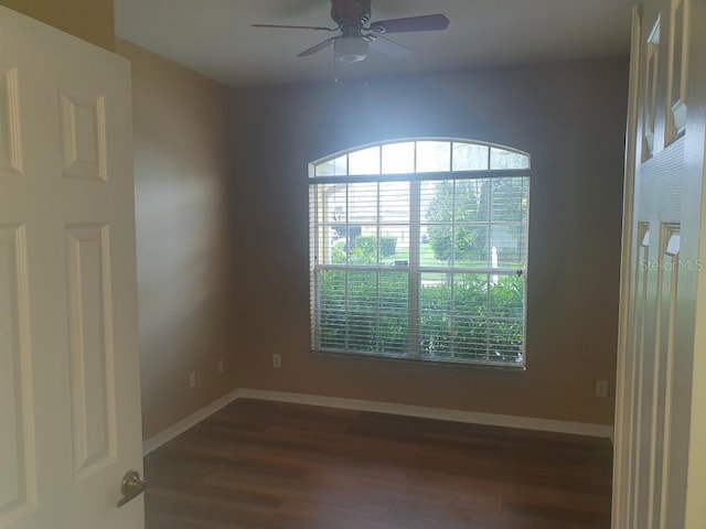 unfurnished room featuring hardwood / wood-style flooring, a healthy amount of sunlight, and ceiling fan