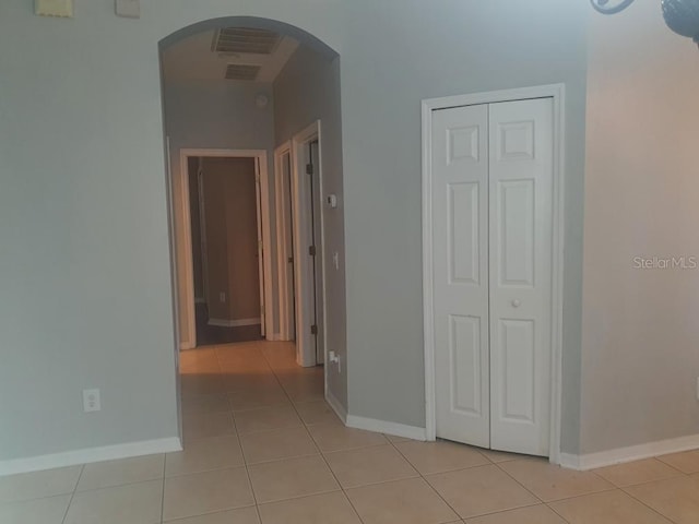 hallway with light tile patterned flooring