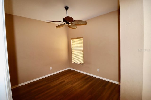 spare room with ceiling fan and dark hardwood / wood-style flooring