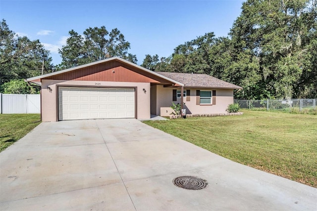 ranch-style home featuring a front yard and a garage