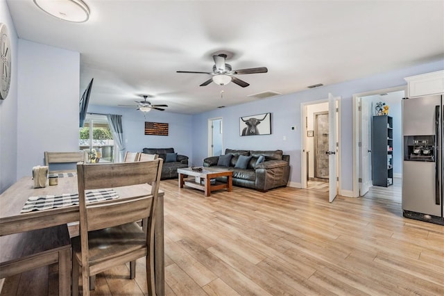 dining room featuring light hardwood / wood-style floors and ceiling fan