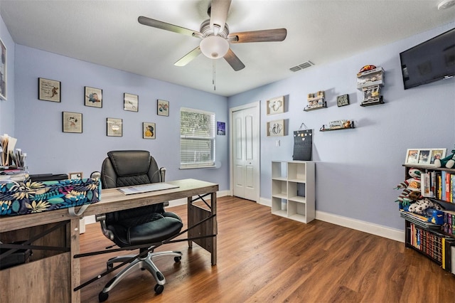 office space featuring wood-type flooring and ceiling fan