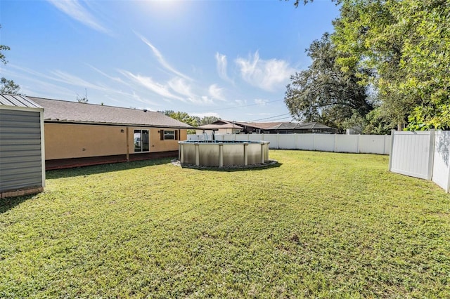 view of yard featuring a fenced in pool