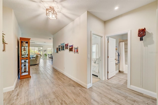 hall with light hardwood / wood-style flooring