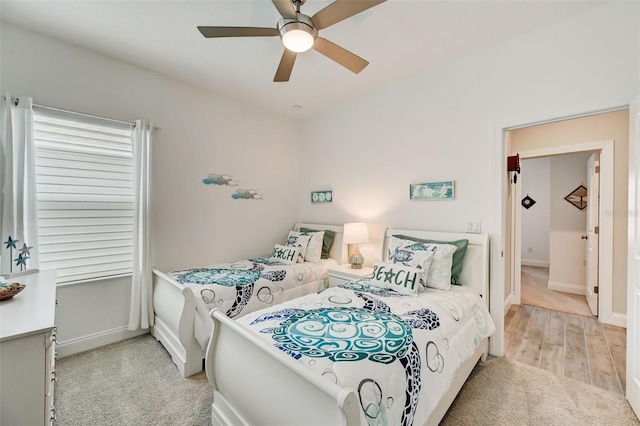 bedroom featuring ceiling fan and light hardwood / wood-style floors