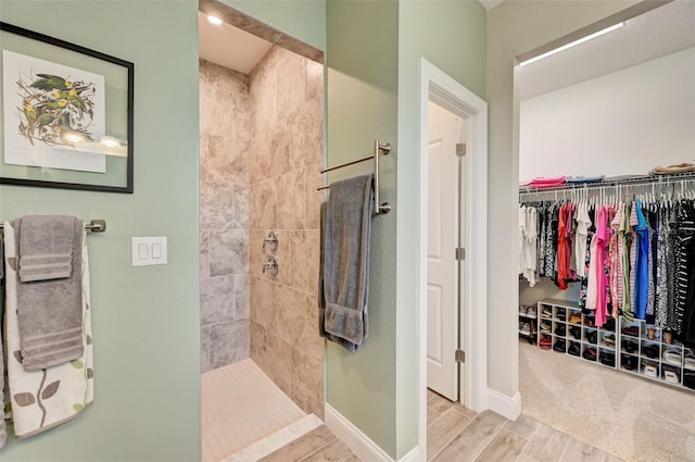 bathroom with a tile shower