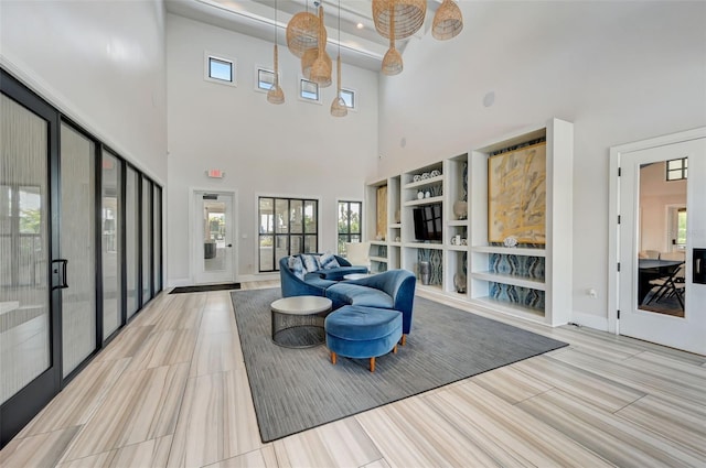 living room with a high ceiling