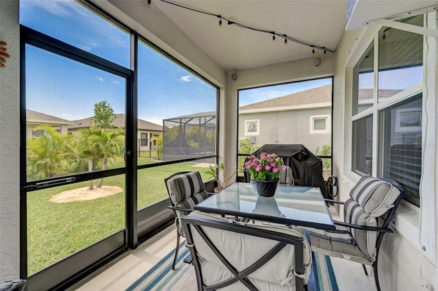 sunroom / solarium with track lighting